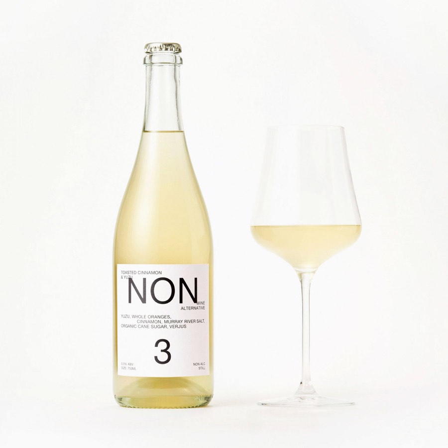 NON 3 bottle beside a poured glass